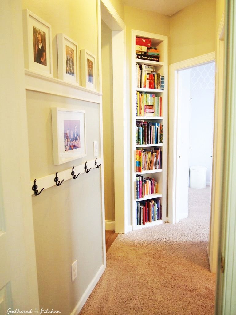 hallway with shelves and hooks