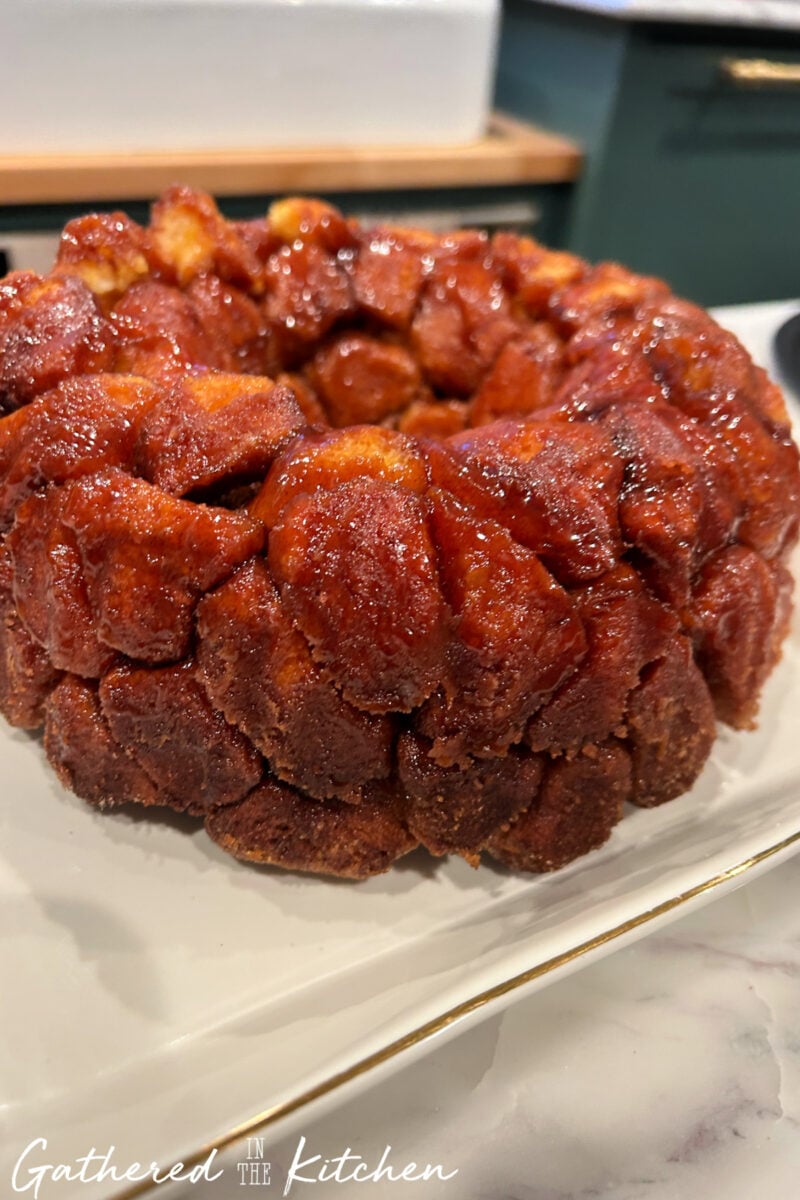 Monkey bread inverted onto serving platter after baking in Bundt pan. | Gathered In The Kitchen 