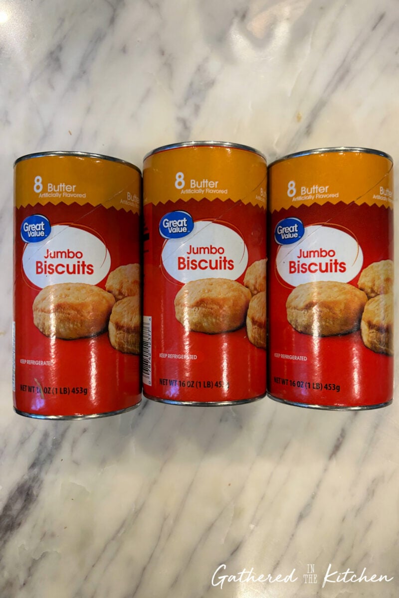Buttered canned jumbo biscuits used to make easy monkey bread with refrigerated biscuit dough. | Gathered In The Kitchen 