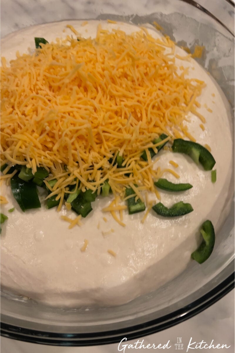 Sourdough dough after bulk fermentation with cheese and jalapeños added before shaping | Gathered In The Kitchen 