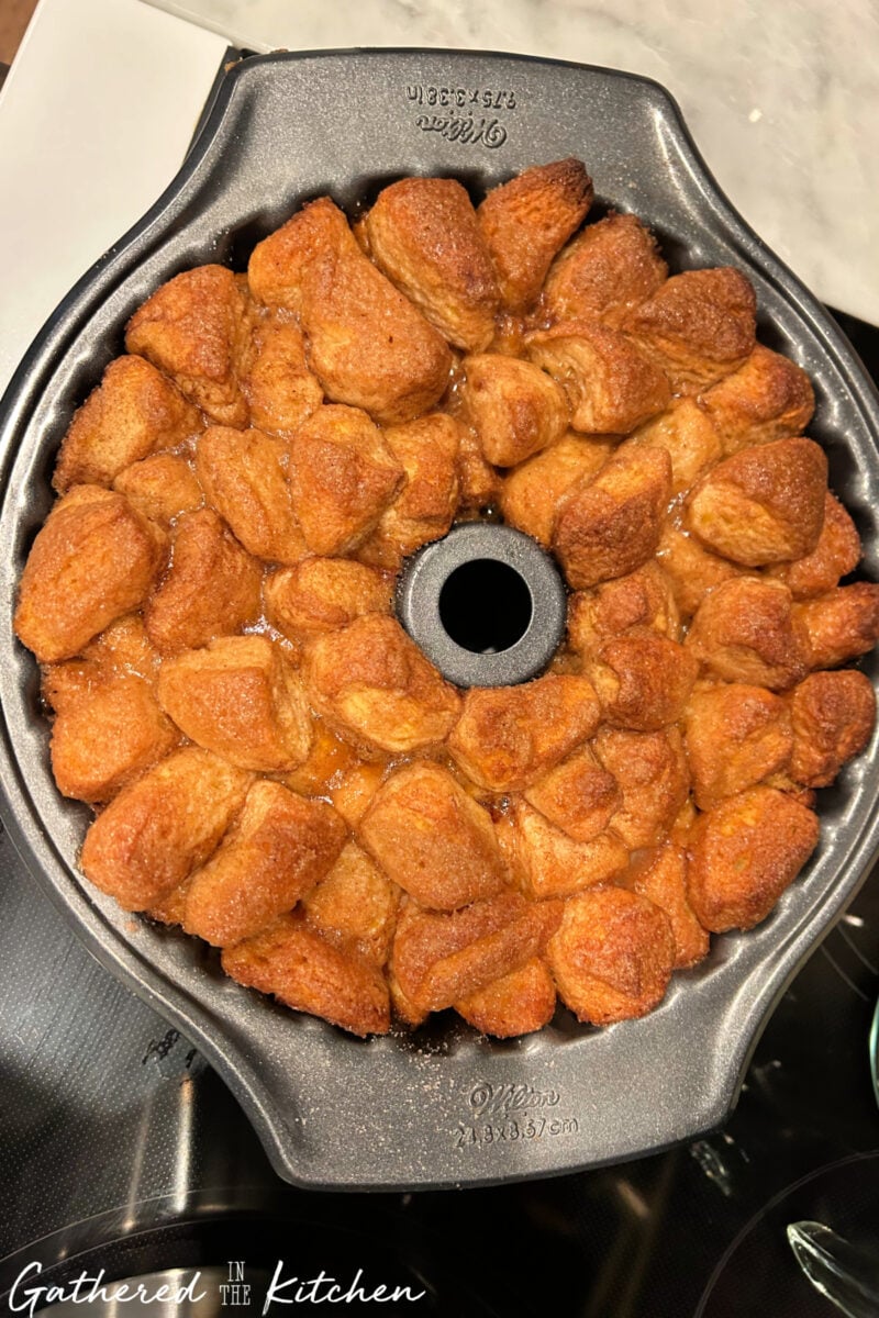 Baked monkey bread in Bundt pan fresh from the oven. | Gathered In The Kitchen 