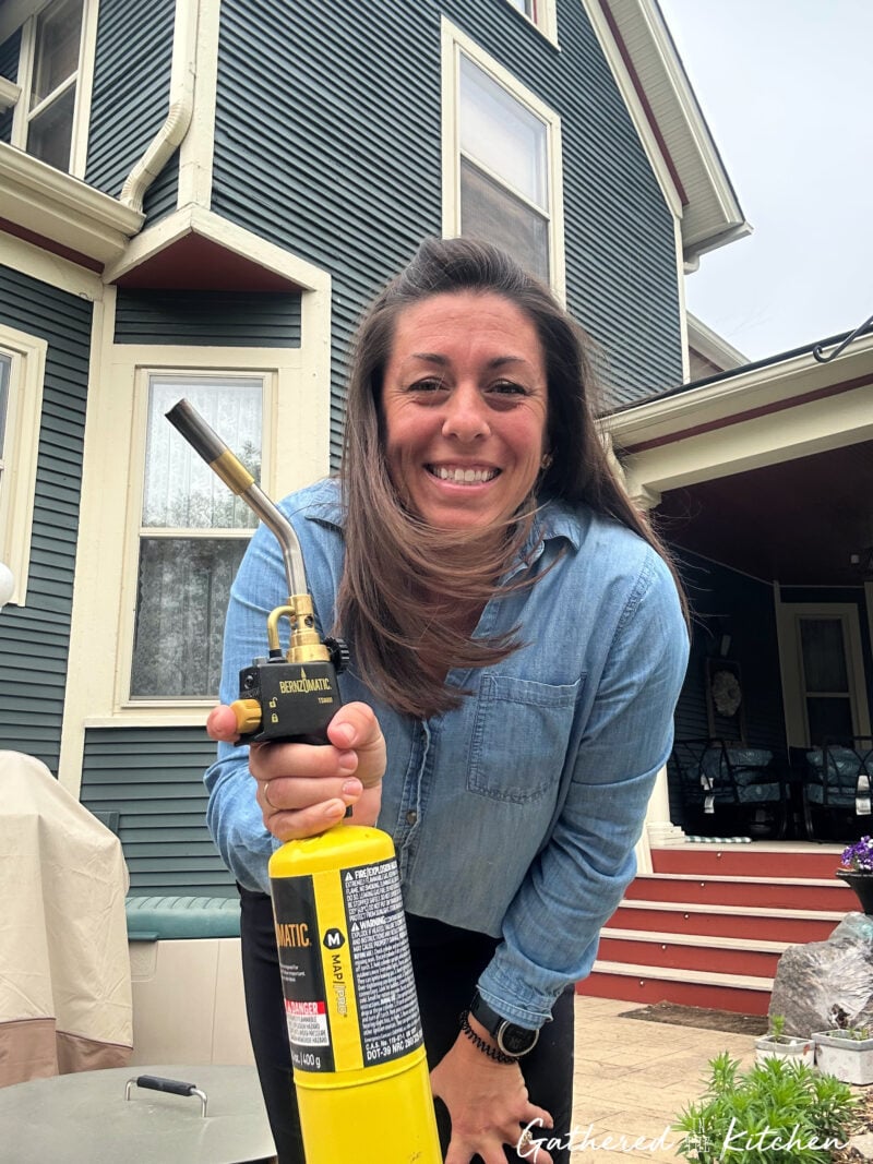 butane weed torch tool used to kill weeds in sidewalk cracks