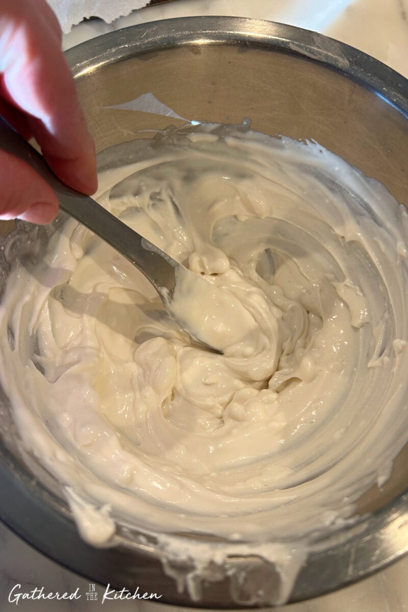 Smooth mixed goat cheese filling in a bowl for homemade fruit danishes | Gathered In The Kitchen 